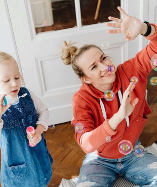 Photo By: Kaboompics.com: https://www.pexels.com/photo/a-girl-blowing-bubbles-7296602/